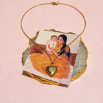 Load image into Gallery viewer, Necklace with a heart-shaped locket on a stone plaque featuring a photo of a woman holding a baby.