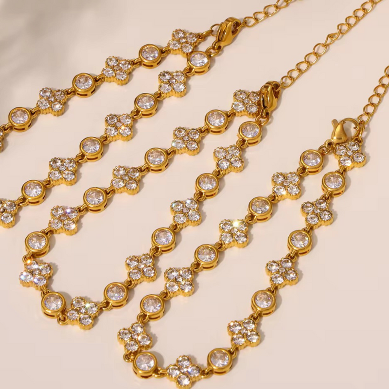 Inaya Modern Festive 18KT Gold Plated Vinatge White Zircon & Flower Bezel Tennis Bracelet, Sana