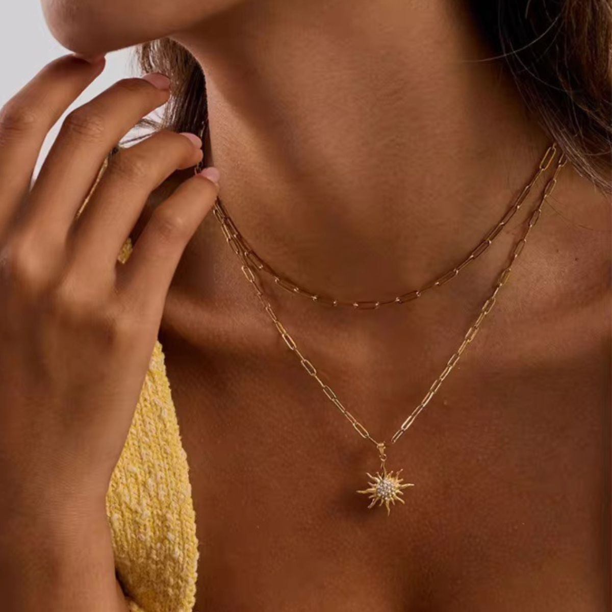 Inaya modern festive 18kt gold plated white rhinestone sun pendant double layered necklace, sun