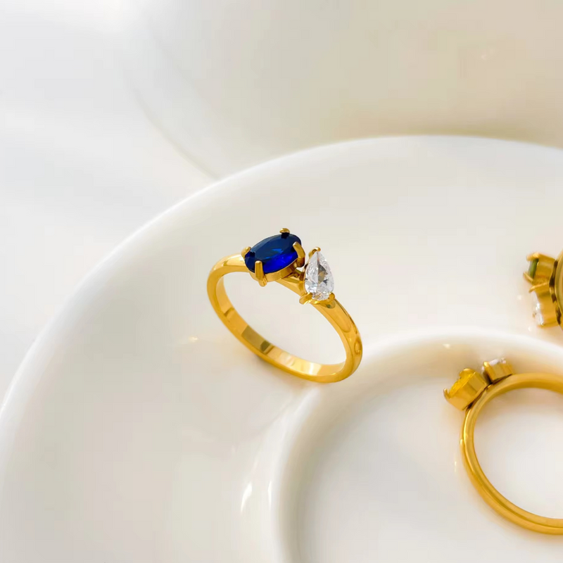 Inaya Modern Festive 18KT Gold Plated Toi et Moi Oval & Pear Shaped Blue Sapphire Solitaire Ring, You&Me